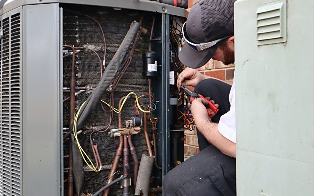 service-repair-being-done-on-a-heat-pump-hvac-system