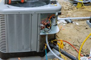 Air conditioning technician of preparing to install new air conditioner. residential-hvac-systems