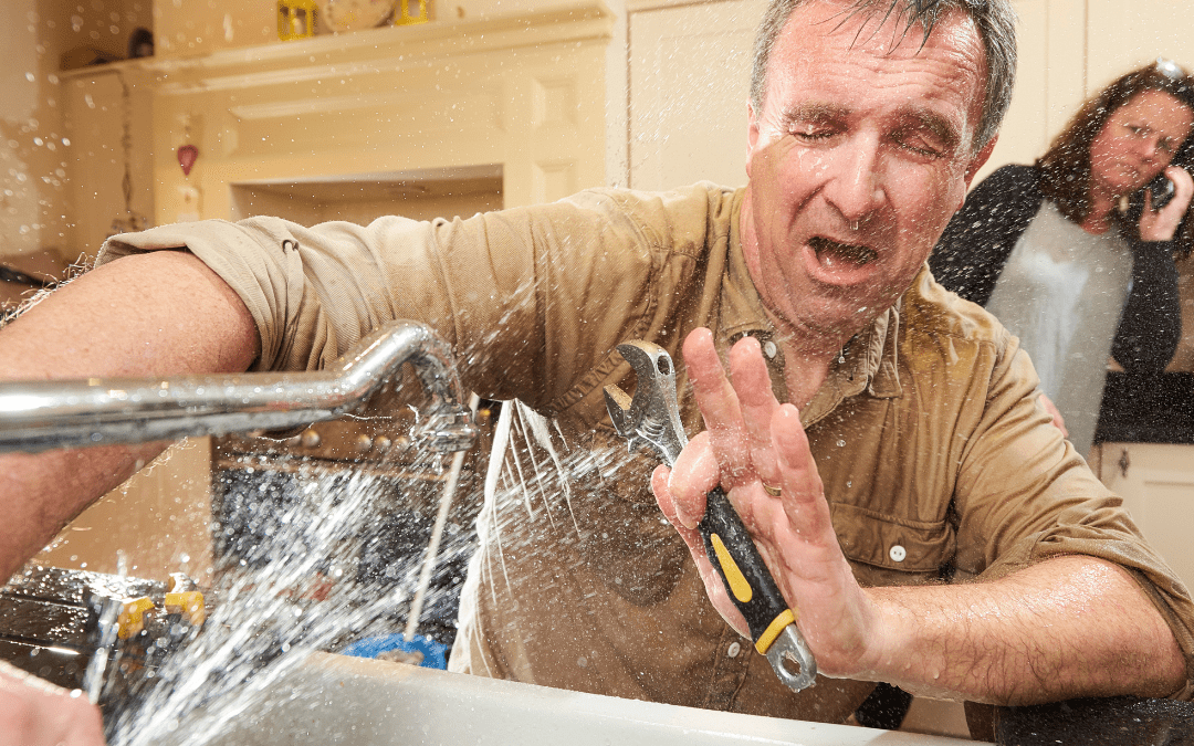 Male-Trying-DIY-Plumbing-Repair-on-Kitchen-Sink