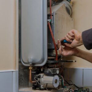 plumber-repairing-tankless-water-heater