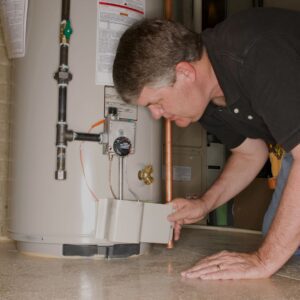 older-man-working-on-a-water-heater
