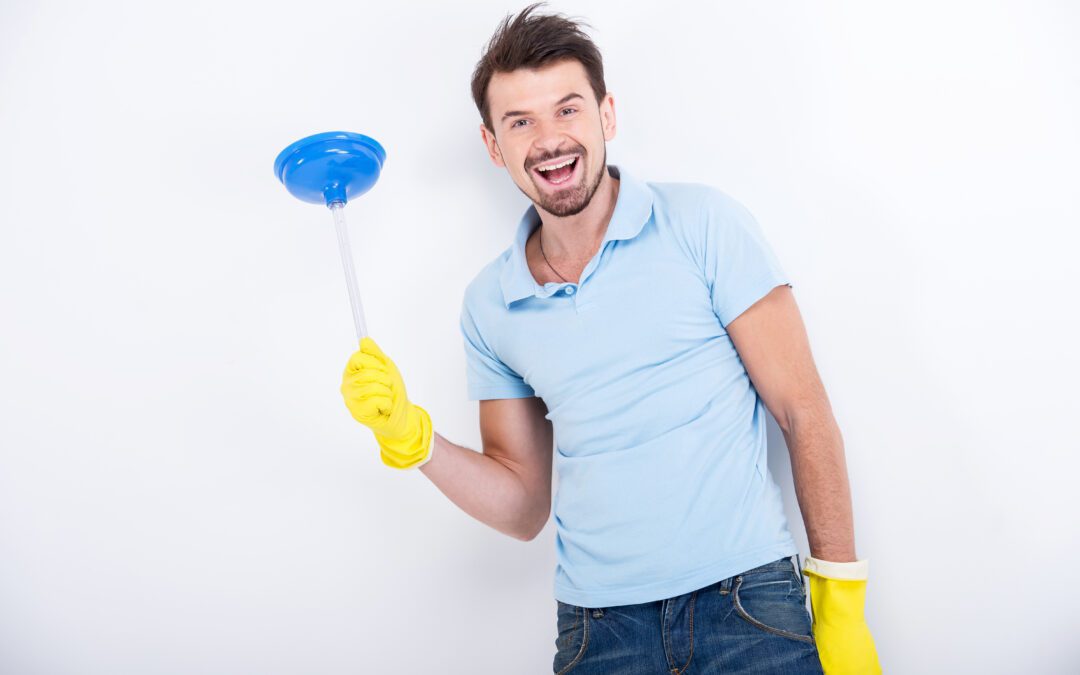Man-in-blue-shirt-with-cleaning-gloves-and-a-plunger