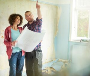 man-talking-with-woman-about-home-renovation-plans
