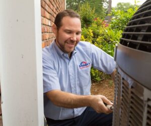 HVAC-Technician-Looking-at-Heating-and-Air-System