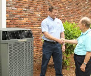 Charleston-Heating-and-Air-Tech-Shaking-Hands-with-Older-Male-Customer
