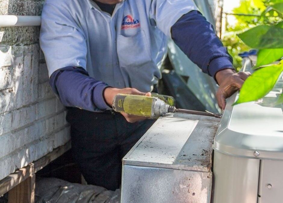 Technician-Using-a-Drill-on-a-Commercial-HVAC-Unit