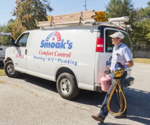 HVAC-Technician-Carrying-Tools-and-Supplies-from-Smoaks-Van