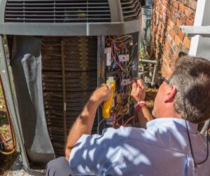 HVAC-Technician-Working-on-Outdoor-Condensing-Unit