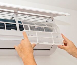 Man-Performing-Maintenance-on-Ductless-Mini-Split
