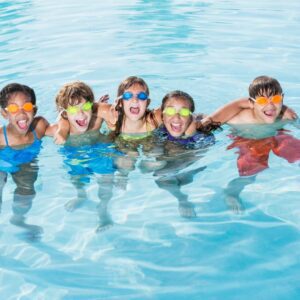 Five-Kids-Standing-in-Pool-with-Swimming-Goggles