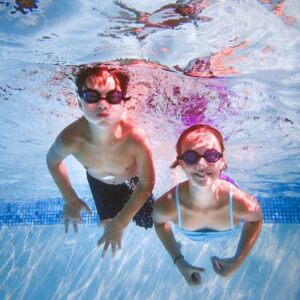 Two-Kids-with-Swim-Goggles-Under-Water