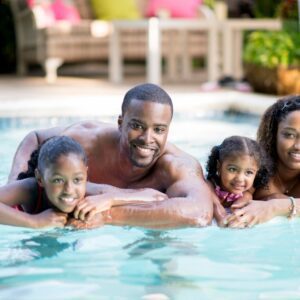 Young-Family-of-Four-Playing-in-Pool